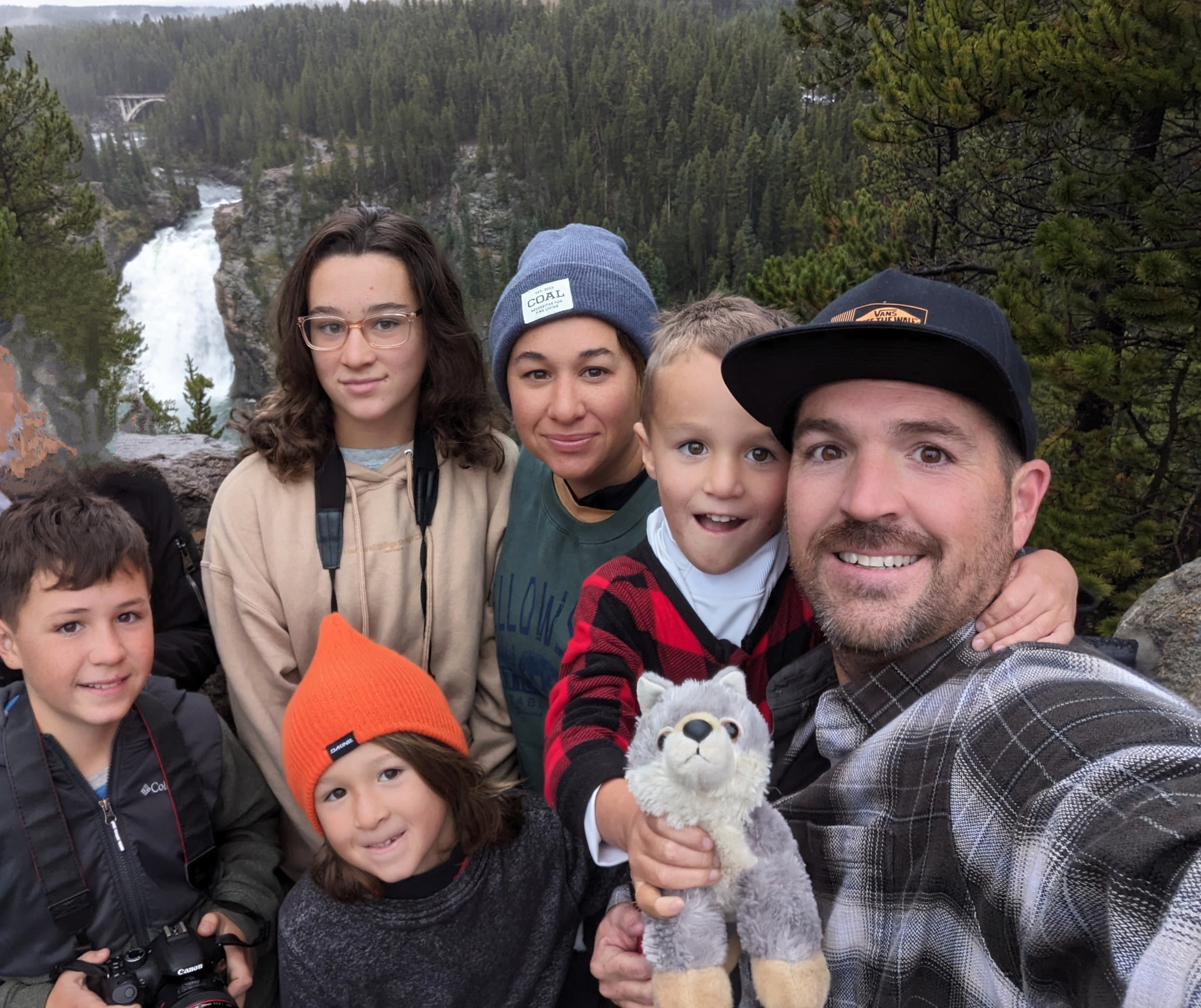 The whole family above a waterfall in Yellowstone
